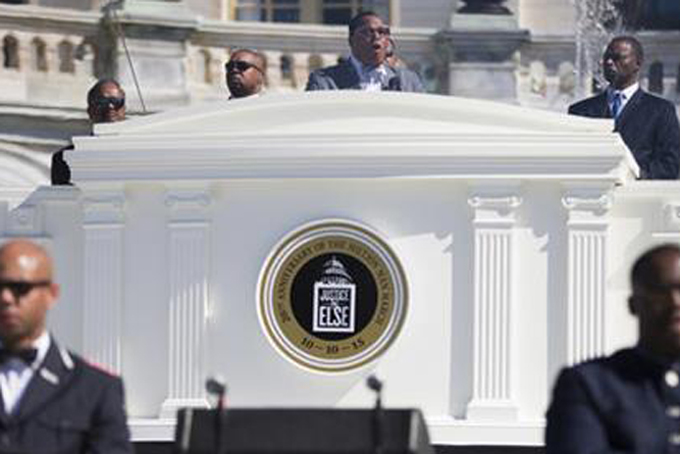 FILE - In this Saturday, Oct. 10, 2015 file photo, Nation of Islam leader Louis Farrakhan speaks during a rally to mark the 20th anniversary of the Million Man March, on Capitol Hill in Washington. Farrakhan said black men and women should forsake foul language and violence against each other and that if things don't change in the black community, participating in the 20th anniversary of the Million Man March is just "vanity." (AP Photo/Evan Vucci)