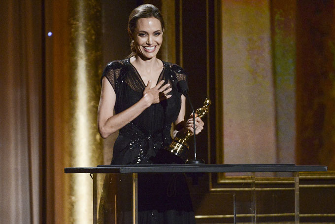 Actress and honoree Angelina Jolie accepts her award at the 2013 Governors Awards on Saturday, Nov. 16, 2013 in Los Angeles. (Photo by Dan Steinberg/Invision/AP)