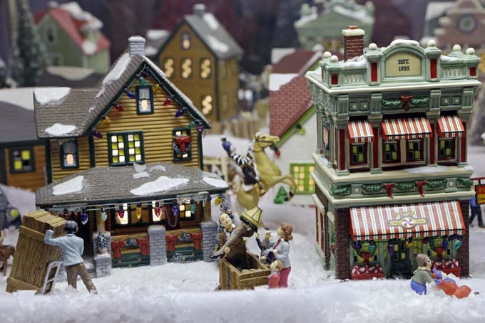 In this Nov. 21, 2013, photo, a miniature street scene from the movie "A Christmas Story" is displayed in the Christmas Story museum in Cleveland.  (AP Photo/Mark Duncan)