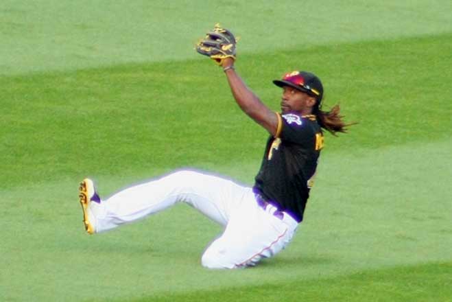 Andrew McCutchen makes a sliding catch against the St Louis Cardinals on July 30 at PNC Park. The Bucs swept the Cards in a rare doubleheader to move into 1st place in the National League Central. (Courier Photo/William McBride/File)