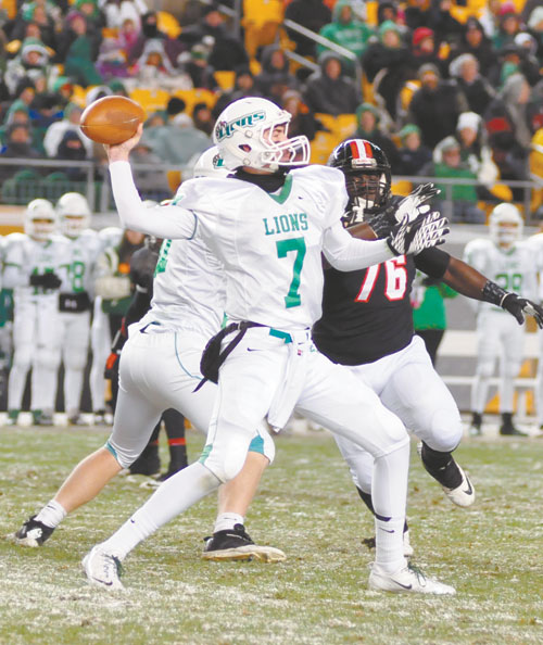 BRETT BRUMBRAUGH (7) South Fayette's junior quarterback did not let the conditions at Heinz Field bother him as he threw for 315 yards and 2 touchdowns in the Lions 34-28 win over Aliquippa in the WPIAL Class AA championship game.