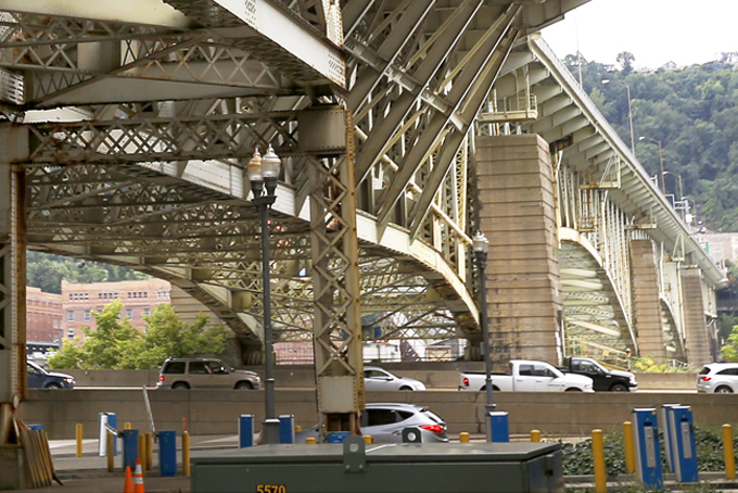 This Sept. 12 photo shows evening rush hour traffic moving along one of Pittsburgh’s parkways under the superstructure of the Liberty Bridge in downtown Pittsburgh, Pa.  (AP Photo/Keith Srakocic/File)