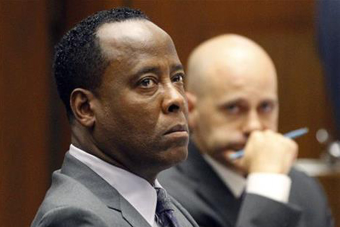 FILE - In this Oct. 3, 2011 file photo, Dr. Conrad Murray listens to testimony seated near his attorney Nareg Gourjian, right, during Murray's trial in the death of pop star Michael Jackson, in Los Angeles. Murray, who was convicted in Jackson's death is suing the state of Texas for stripping his right to practice medicine, and his attorney said Thursday, Oct. 31, 2013, that the cardiologist has former patients eager for him to work again.(AP Photo/Mario Anzuoni, Pool, File)