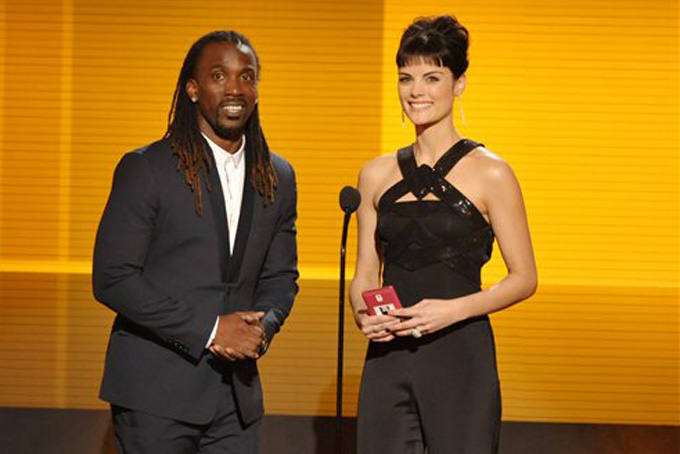 Pittsburgh Pirates baseball player Andrew McCutchen, left, and Jaimie Alexander present the award for favorite male artist - country at the American Music Awards at the Nokia Theatre L.A. Live on Sunday, Nov. 24, 2013, in Los Angeles. (Photo by John Shearer/Invision/AP)