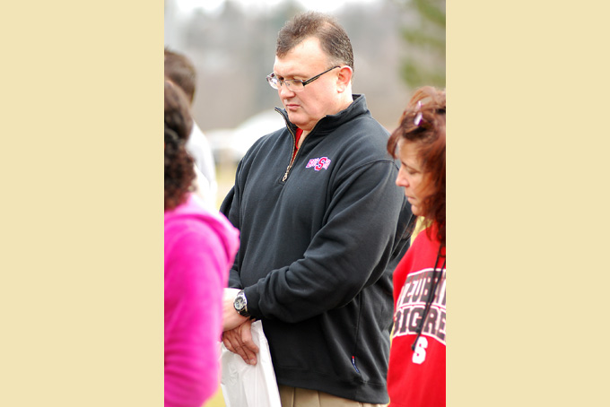In this Saturday, Jan. 12, 2013 photo, Steubenville City Schools Superintendent Michael McVey prays during a Stand Up For Steubenville rally at Jim Wood Park in Steubenville, Ohio. (AP Photo/Steubenville Herald-Star, Michael D. McElwain) 