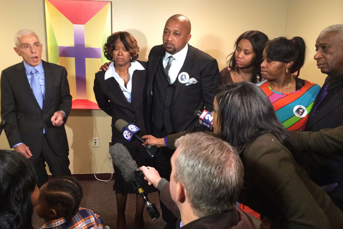 Photo of Renisha McBride's parents (Monica McBride and Walter Ray Simmons) along side the family's attorney Gerald Thurswell on the left, and other family and the family spokesman Ron Scott on the right. (Photo: CNN/Chris Welch)