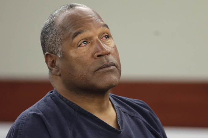 This May 13, 2013 file photo shows O.J. Simpson listening to testimony at an evidentiary hearing in Clark County District Court in Las Vegas. (AP Photo/Julie Jacobson, Pool, File)