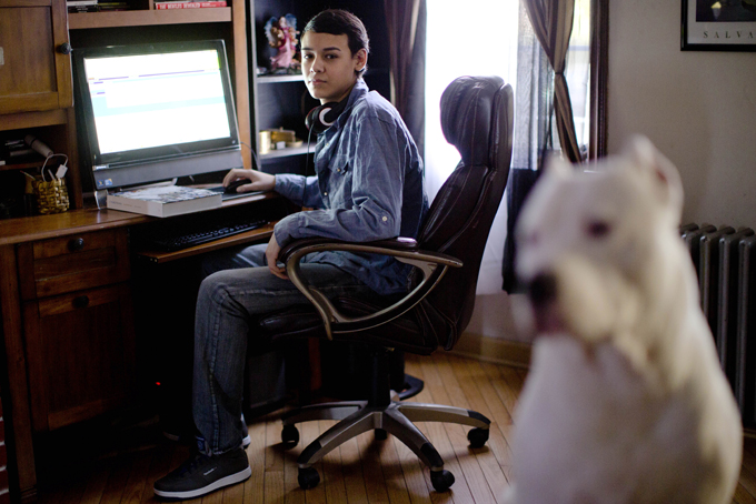 High school student Vito Calli, 15, poses for a portrait by his computer at his home in Reading, Pa. (AP Photo/Matt Rourke)