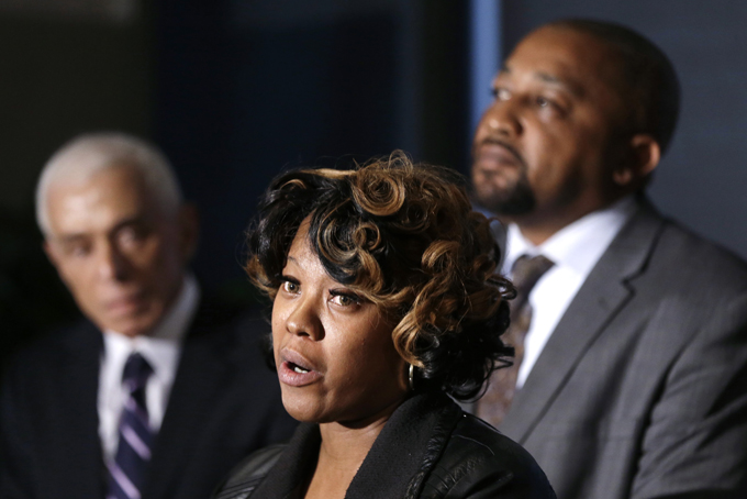 Monica McBride, center, and Walter Ray Simmons, right, the parents of Renisha McBride address the media with attorney Gerald Thurswell, left, during a news conference in Southfield, Mich., Friday, Nov. 15, 2013. Their daughter was shot on Nov. 2 in the face on Theodore P. Wafer's front porch in Dearborn Heights. (AP Photo/Carlos Osorio)