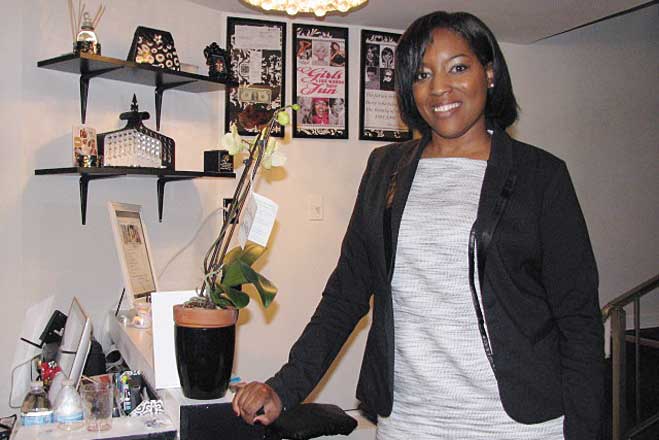 READY FOR BUSINESS—Latoya Johnson-Rainey, the owner of A Hair Boutique Shadyside takes a moment to view the renovations of her shop, 5510 Centre Ave­nue. (Photos by Diane Daniels) 