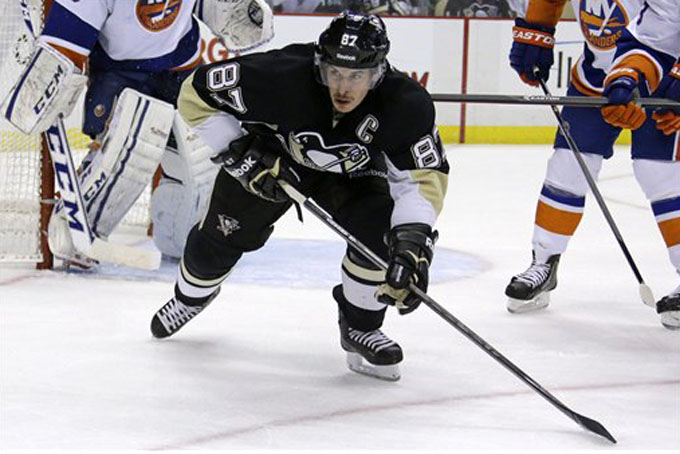 Pittsburgh Penguins center Sidney Crosby (87) skates in the second period of a NHL hockey game against the New York Islanders in Pittsburgh Friday, Nov. 22, 2013. (AP Photo/Gene J. Puskar)