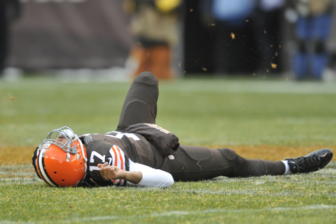 Cleveland Browns quarterback Jason Campbell lies near midfield after suffering a concussion in the third quarter against the Pittsburgh Steelers in an NFL football game Sunday, Nov. 24, 2013. Pittsburgh won the game 27-11. (AP Photo/David Richard)