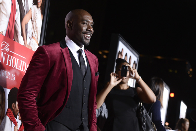Actor Morris Chestnut arrives on the red carpet for the world premiere of the feature film "The Best Man Holiday" at the TCL Chinese Theatre on Nov. 5, 2013 in Los Angeles. (Photo by Dan Steinberg/Invision/AP)