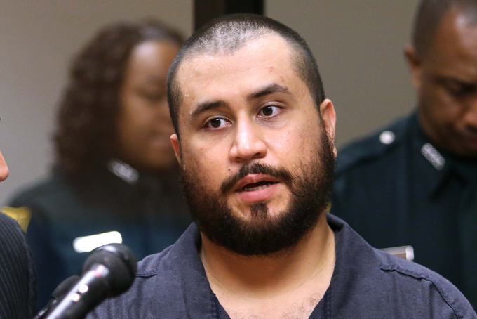 George Zimmerman answers questions from a Seminole circuit judge as public defender Daniel Megaro listens, Tuesday, Nov. 19, 2013, in Sanford, Fla. during a first-appearance hearing on charges including aggravated assault stemming from a fight with his girlfriend. (AP Photo/Orlando Sentinel, Joe Burbank, Pool)