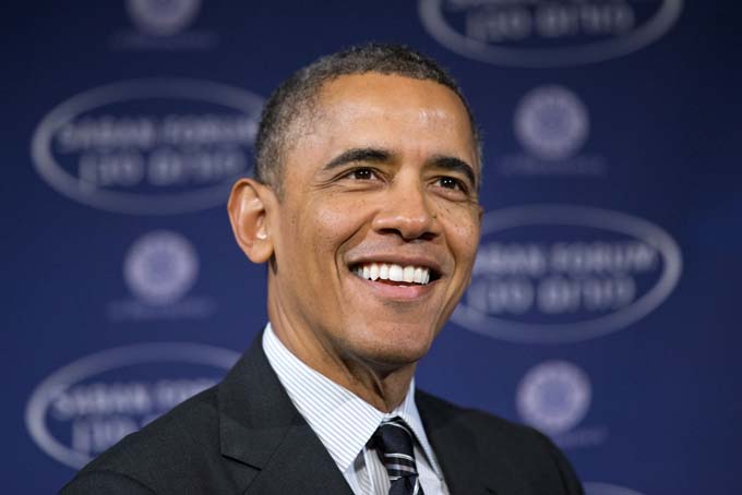 In this Dec. 7, 2013 file photo, President Barack Obama smiles as he arrives at the Saban Forum to speak about the Middle East at the Willard Hotel in Washington. (AP Photo/Jacquelyn Martin)