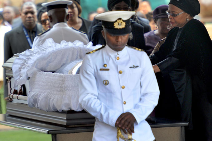Nelson Mandela's widow Graca Machel pays her respects to former South African President Nelson Mandela during the lying in state at the Union Buildings in Pretoria, South Africa, Wednesday, Dec. 11, 2013. (AP Photo/Elmond Jiyane, GCIS)