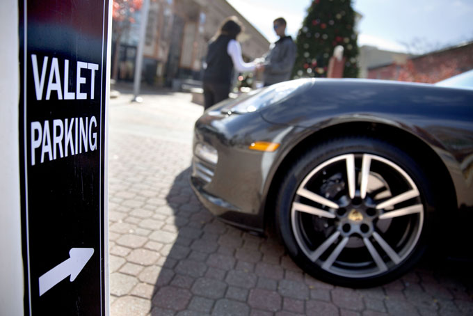 A sign points shoppers to the valet parking at Cobb County's Cumberland Mall, less than two miles from where the Atlanta Braves plan to build a new stadium, Wednesday, Nov. 20, 2013, in Atlanta.