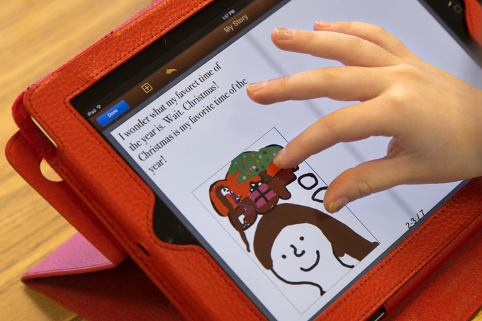 Clara Miller, 7, works on an e-book on an iPad in her second grade class at Jamestown Elementary School in Arlington, Va.  (AP Photo/Jacquelyn Martin)