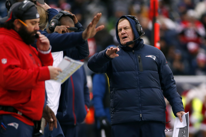 New England Patriots head coach Bill Belichick, right, speaks to coaches on his bench during an NFL football game against the Cleveland Browns in Foxborough, Mass., Sunday, Dec. 8, 2013. The Patriots came from behind to win 27-26. (AP Photo/Elise Amendola)