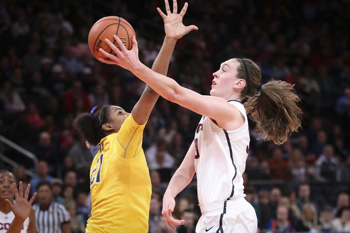 Connecticut forward Breanna Stewart, right, shoots against California forward Reshanda Gray (21) during the first half of an NCAA college basketball game as part of the Maggie Dixon Basketball Classic at Madison Square Garden, Sunday, Dec. 22, 2013, in New York. (AP Photo/John Minchillo)