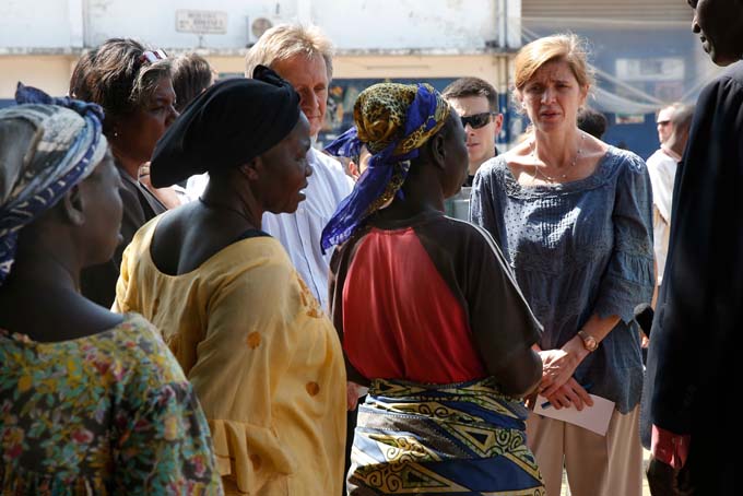 U.S. Ambassador to the United Nations Samantha Power speaks to refugee women at the makeshift camp where more than 40,000 found refuge at the airport in Bangui, Central African Republic, Thursday, Dec. 19, 2013. Power is on a one-day trip to the war-stricken region. (AP Photo/Jerome Delay)