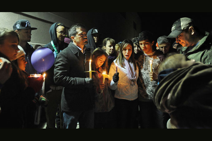 The emotional family of Kiana O'Neil came to a candlelight vigil for Kiana at Springs Ranch Elementary School on Saturday, Dec. 28, 2013 in Colorado Springs, Colorado. (AP Photo/The Gazette, Jerilee Bennett)