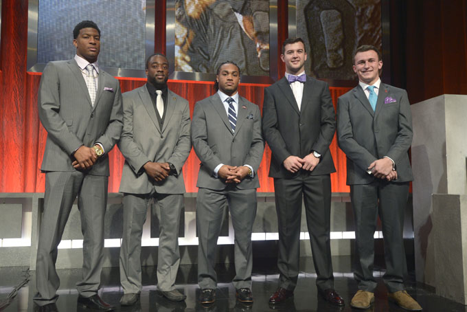 Heisman Trophy finalists Florida State quarterback Jameis Winston, left, Boston College running back Andre Williams, second from left, Auburn running back Tre Mason, center, Alabama quarterback AJ McCarron, second from right, and Texas A&M quarterback Johnny Manziel pose for a photo after the College Football Awards show in Lake Buena Vista, Fla., Thursday, Dec. 12, 2013.(AP Photo/Phelan M. Ebenhack)