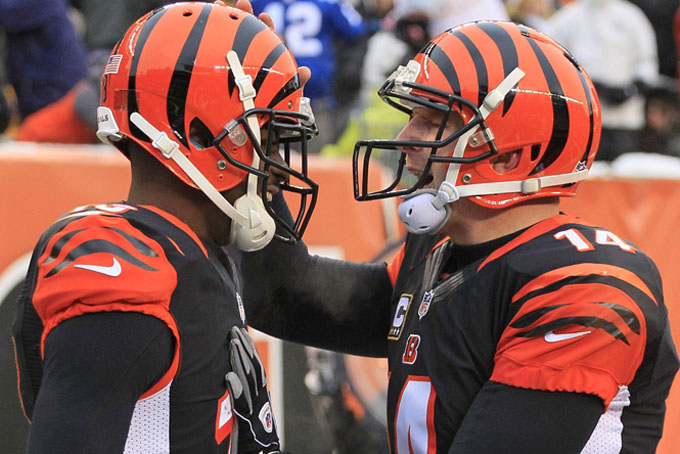 Cincinnati Bengals quarterback Andy Dalton (14) congratulates wide receiver A.J. Green (18) after Green caught a 9-yard touchdown pass from Dalton in the second half of an NFL football game against the Indianapolis Colts, Sunday, Dec. 8, 2013, in Cincinnati. (AP Photo/Tom Uhlman) 