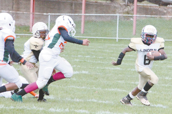 DARUS BRUCE (6) was outstanding on defense and offense as he picks up rushing yardage here to help his team to the win. 