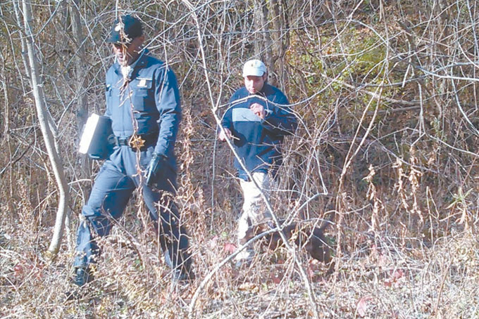 GETTING PREPARED—Conscience Group founder David Adams and field specialist Tony Lewis mark trails and waterways around Clairton for future emergency response and resilience training.