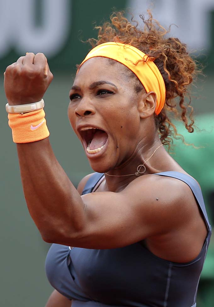  In this June 8, 2013 file photo, Serena Williams, of the U.S, celebrates a winning point as she plays Russia's Maria Sharapova during the Women's final match of the French Open tennis tournament at the Roland Garros stadium in Paris. (AP Photo/Michel Euler, File)