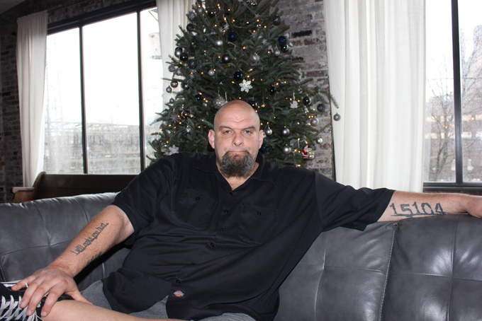 Braddock mayor John Fetterman is interviewed in his home by Merecedes Howze about the movie “Out of the Furnace”. (Courier Photo by J.L. Martello)