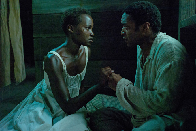 This image released by Fox Searchlight shows Lupita Nyong’o, left, and Chiwetel Ejiofor in a scene from "12 Years A Slave." (AP Photo/Fox Searchlight, Francois Duhamel)