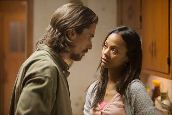 This image released by Relativity Media shows Christian Bale, left, and Zoe Saldana in a scene from "Out of the Furnace." (AP Photo/Relativity Media, Kerry Hayes)