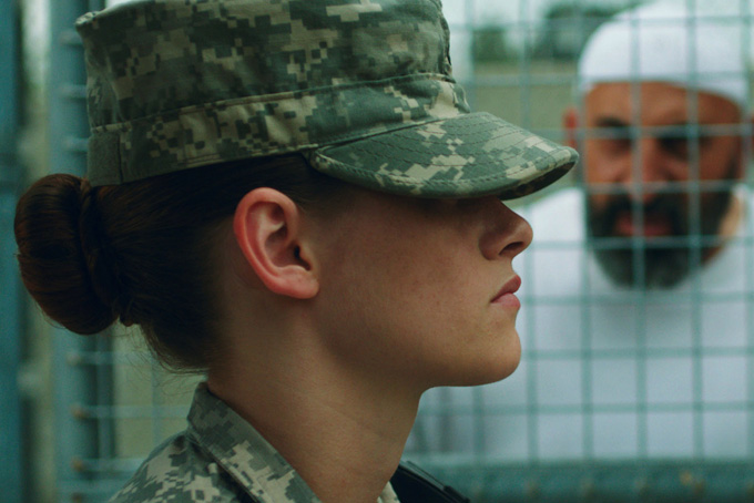 This photo provided by the Sundance Institute shows Kristen Stewart in a scene from the film, "Camp X-Ray." In her first feature since “The Twilight Saga: Breaking Dawn - Part 2,” Stewart plays a guard stationed in Guantanamo Bay in budding writer/director Peter Sattler’s film. (AP Photo/Sundance Institute, Beth Dubber)