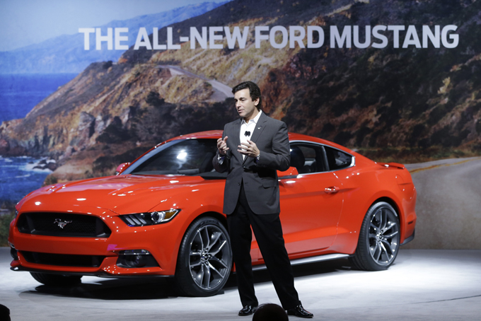  Mark Fields, chief operating officer for Ford Motor Company, unveils the automaker's new 2015 Ford Mustang in Dearborn, Mich., Thursday, Dec. 5, 2013. (AP Photo/Carlos Osorio)