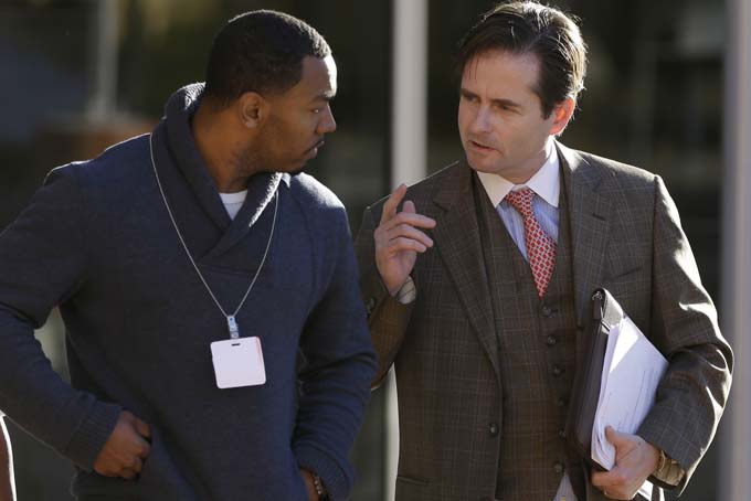 Omari Sealey, left, uncle of Jahi McMath, speaks with attorney Christopher Dolan prior to a media conference Thursday, Dec. 19, 2013, in front of Children's Hospital in Oakland, Calif. (AP Photo/Ben Margot)