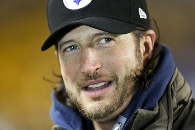 Pittsburgh Pirates pitcher Jason Grilli watches from the sidelines during warm ups before an NFL football game between the Pittsburgh Steelers and the Cincinnati Bengals in Pittsburgh, Sunday, Dec. 15, 2013. (AP Photo/Gene J. Puskar)