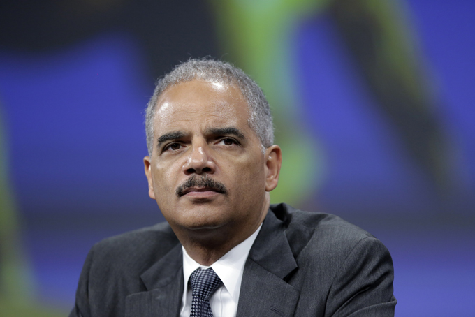 Attorney General Eric Holder listens to a speech after of his remarks during the Annual International Association of Chiefs of Police Conference, at the Pennsylvania Convention Center in Philadelphia in October. (AP Photo/Matt Rourke)