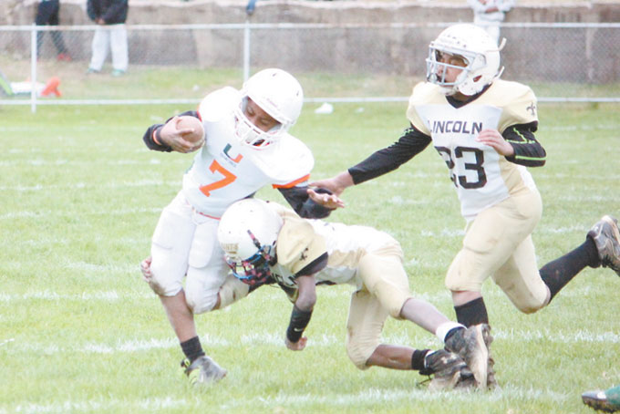 JASHAWN WILLIAMS (7) 10 years old gets the call on one of his many carries.  