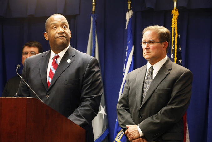 Andre Birotte, U.S. Attorney for the Central District of California, at podium, and Bill Lewis, Assistant Director in Charge of the FBI’s Los Angeles Division, right, take questions on the five criminal cases filed against 18 current and former Los Angeles County sheriff’s deputies as part of an FBI investigation into allegations of civil rights abuses and corruption in the nation’s largest jail system, during a news conference in Los Angeles, Monday, Dec. 9, 2013. (AP Photo/Nick Ut)