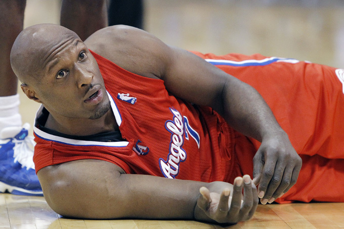In this March 26, 2013, file photo, Los Angeles Clippers' Lamar Odom looks on from the court during an NBA basketball game in Dallas. (AP Photo/Brandon Wade, File)