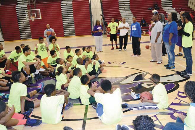 Lessons—Young hoop stars give their full attention to learn the fundamentals of the game. (Photos by Rossano P. Stewart)
