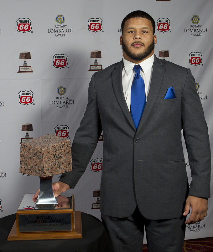 Pittsburgh defensive tackle Aaron Donald poses for a portrait with the Rotary Lombardi Award prior to the awards ceremony on Wednesday, Dec. 11, 2013, in Houston. Donald won the award on Wednesday night. (AP Photo/Houston Chronicle, James Nielsen)