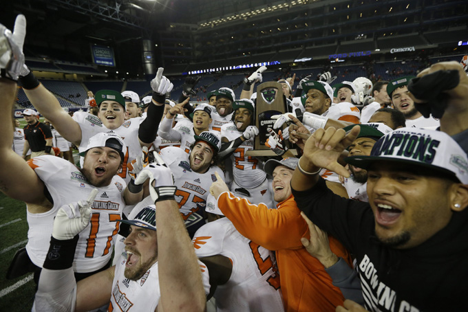 The Bowling Green team celebrate their win in an NCAA college football game against Northern Illinois at the Mid-American Conference championship in Detroit, Friday, Dec. 6, 2013. Bowling Green defeated Northern Illinois 47-27. (AP Photo/Carlos Osorio)