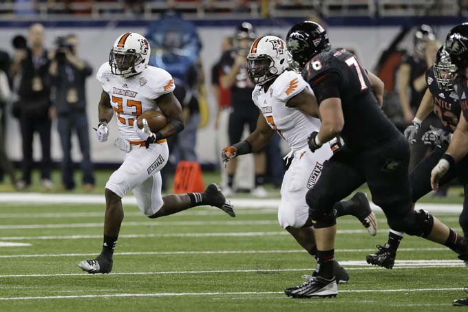 Bowling Green defensive back Aaron Foster (23) returns an interception for 37-yards during the second half of an NCAA college football game against Northern Illinois at the Mid-American Conference championship in Detroit, Friday, Dec. 6, 2013. (AP Photo/Carlos Osorio)