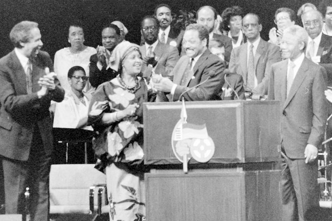 Left to Right. Randall Robinson, Dorothy Height (2nd, Back Row), Congressman Walter Fauntroy (3rd, Back Row), Winnie Mandela (4th), Councilman Frank Smith (5th, Back Row), Jesse Jackson (6th), Nelson Mandela (7th) at the ANC Rally at the Convention Center in Washington, DC (Photo by Roy Lewis)