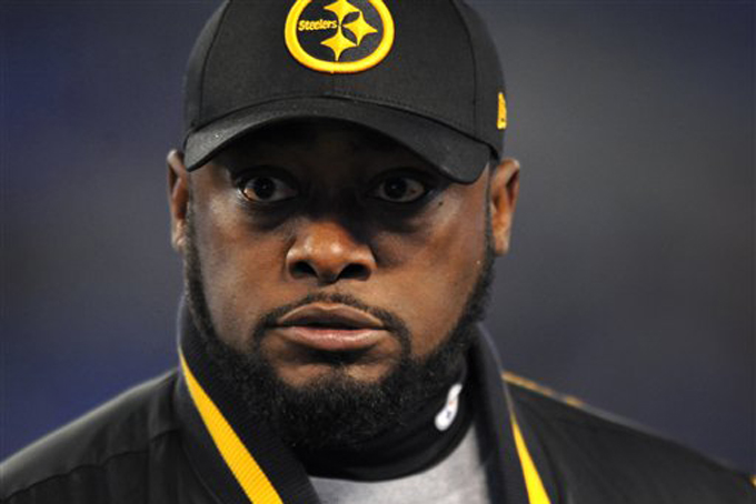 Pittsburgh Steelers head coach Mike Tomlin watches his players warm up before game against the Baltimore Ravens, Nov. 28, 2013, in Baltimore. (AP Photo/Gail Burton)