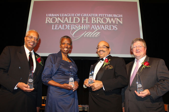 A NIGHT FOR LEADERS—From left: Jack Daniel, Jerlean Daniel, Chris Moore and Tim Nettles, were all honored for the outstanding leadership at the Urban League of Greater Pittsburgh's 18th Annual Ronald H. Brown Leadership Awards Gala on Dec. 6 at Heinz Field. (Photo by J.L.Martello)