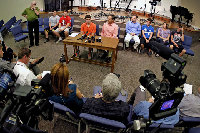 In this June 18, 2013 photo, Evan Jennings speaks to the media about his father, Brian Jennings, as he sits with friends and senior pastor Scott Sharman. Brian Jennings was killed in a drunken-driving crash. A North Texas juvenile court judge has sentenced a 16-year-old boy to probation for the crash that killed four people on Tuesday, Dec. 10, 2013. (AP Photo/The Fort Worth Star-Telegram, Paul Moseley) 